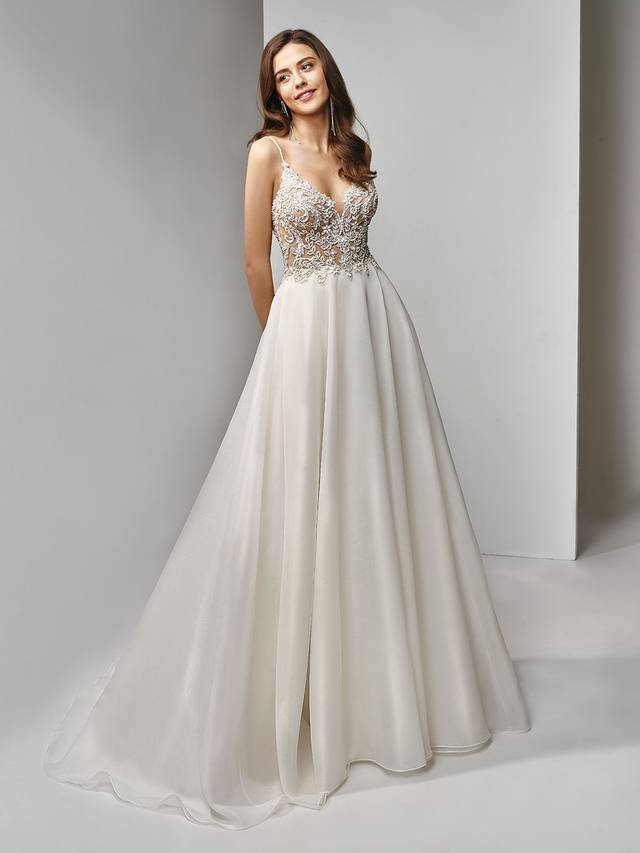 Code: Enzoani Beautiful BT19-01 Code: Enzoani Beautiful BT19-01 A gorgeous full-length, A-line gown with an illusion beaded, embroidered lace bodice paired with a dreamy organza skirt. The sleek spaghetti straps and classic covered buttons in the back create the perfect modern fairytale wedding gown.Colour Options : Ivory/Nude OR Ivory/Ivory