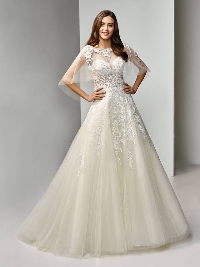 Code: Enzoani Beautiful BT19-08 with Tulle Jacket Code: Enzoani Beautiful BT19-08 with Tulle Jacket An elegant, strapless sweetheart modified A-line gown with cascading beaded embroidered lace over a full tulle skirt. The illusion bodice creates just enough allure to play up an especially romantic style. Paired with a jacket for a sophisticated, timeless look.Colour Options : Ivory/Beige OR Ivory/Ivory