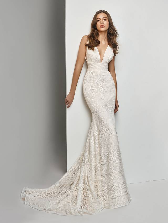 Code: Enzoani Beautiful BT19-12 Code: Enzoani Beautiful BT19-12 Gorgeously structured, this striking, all-over lace mermaid gown takes modern elegance to a whole new level. The glamourous open back complements the alluring low V-neckline, while lace banding at the waist flatters the figure. The sweet lace details are pulled together with an invisible zipper to create a seamless, mesmerizing look.Colour Options : Ivory/Cream OR Ivory/Ivory