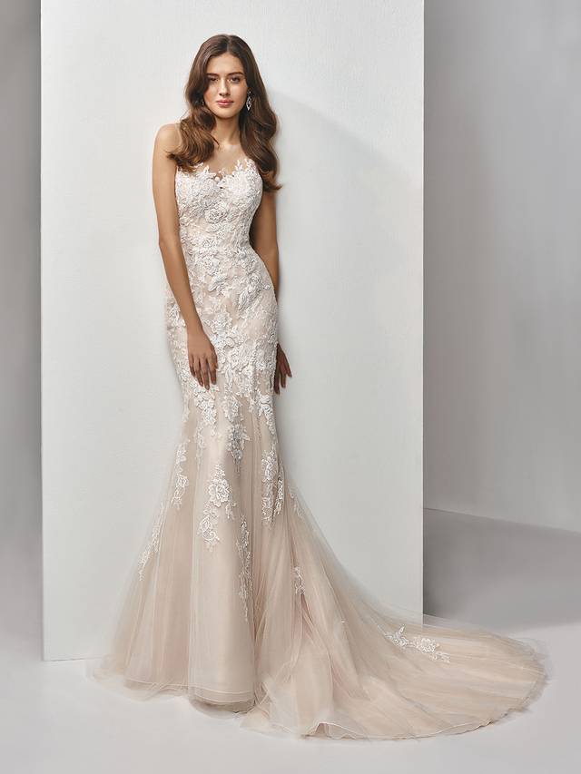 Code: Enzoani Beautiful BT19-14 Code: Enzoani Beautiful BT19-14 Sweet, elegant, romantic. This full-length mermaid gown features delicately beaded, embroidered and chantilly lace laid out on the softest tulle for a dreamy effect complemented by the illlusion bateau sweetheart neckline. A low illusion back with covered buttons adds a striking finishing touch.Colour Options : Ivory/Latte OR Ivory/Ivory