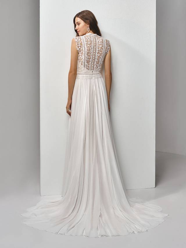 Code: Enzoani Beautiful BT19-19 Code: Enzoani Beautiful BT19-19 Feminine and romantic with vintage vibes and a boho feel -- this full-length, A-line gown features a striking bodice with exquisite eyelet lace with sweet floral motifs. A deep sweetheart neckline adds some modern sexiness to balance out the slightly high neck and cap sleeves. Light chiffon is a soft, dreamy complement to the bodice and matching illusion eyelet lace back with covered buttons and invisible zipper closure.Colour Options : Ivory/Latte OR Ivory/Ivory