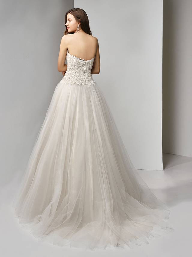 Code: Enzoani Beautiful BT19-21 Code: Enzoani Beautiful BT19-21 Bring out your inner princess in this full A-line ball gown fit for a fairytale. A deep strapless sweetheart neckline provides plenty of allure as the beaded, embroidered lace bodice captures the eye and complements the voluminous, dreamy tulle skirt. The lovely look is finished with an invisible back zipper closure.Colour Options : Ivory/Beige OR Ivory/Ivory