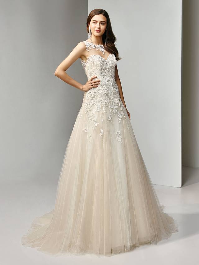Code: Enzoani Beautiful BT19-23 Code: Enzoani Beautiful BT19-23 Utterly romantic. This full-length, modified A-line gown features intricately beaded, embroidered lace and cascading tulle layers. An illusion bateau over sweetheart neckline is romantically offset with a matching low, illusion V-back with covered buttons and an invisible zipper closure.Colour Options : Ivory/Beige/Pewter OR Ivory/Ivory/Pewter