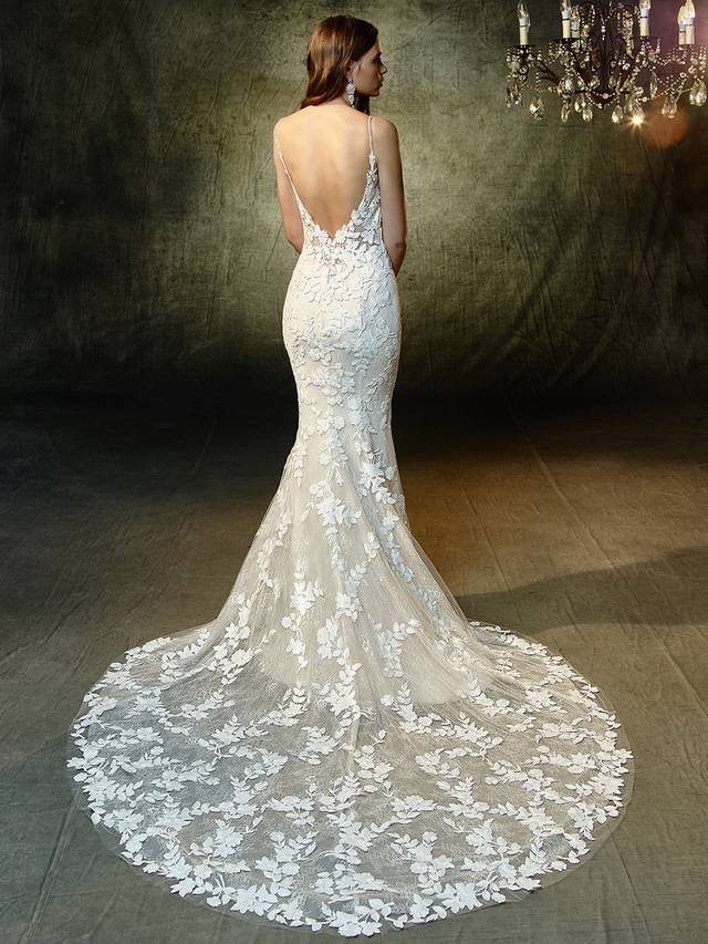 Code: Enzoani Blue Lesley Code: Enzoani Blue Lesley Step straight out of a floral fairytale dream and onto the aisle in this sweet mermaid gown with delicate spaghetti straps framing the sexy, deep sweetheart neckline. Intricate embroidered lace and chantilly lace appliques lightly layer over the softest tulle, creating an ethereally romantic look.Colour Options : Ivory/Sand OR Ivory/Ivory