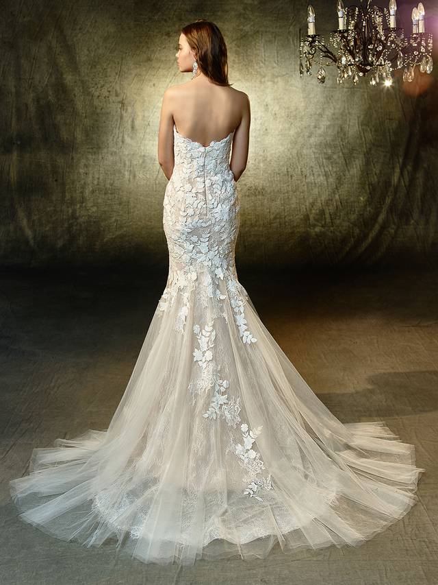 Code: Enzoani Blue Livie Code: Enzoani Blue Livie Picture-perfect and oh, so romantic. This full-length mermaid gown showcases a deep strapless sweetheart neckline bodice adorned with feminine, floral embroidered lace and chantilly lace that cascades down onto the soft tulle skirt. An invisible back zipper completes the lovely look.Colour Options : Ivory/Mocha OR Ivory/Ivory