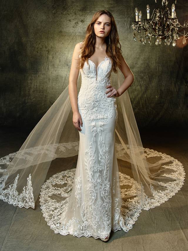Code: Enzoani Blue Lunaire with Detachable Train Code: Enzoani Blue Lunaire with Detachable Train A gorgeously modern gown with vintage vibes and flair. This full-length mermaid gown features a plunging sweetheart neckline and illusion lace straps that extend into a breathtaking illusion keyhole back to keep everyone captivated as you come and go. Sequin, embroidered lace and delicate glitter tulle provides subtle, all-over sparkle while the spectacular scalloped hem lace train is guaranteed to be picture perfect.Colour Options : Ivory/Sand OR Ivory/Ivory