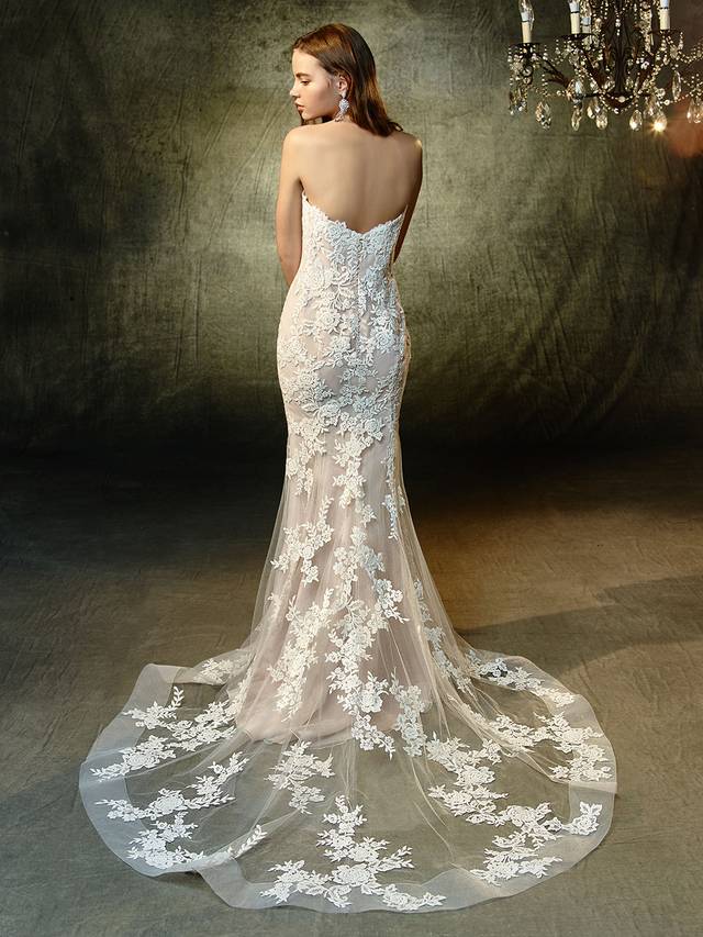 Code: Enzoani Blue Lyric Code: Enzoani Blue Lyric As sweet as a melody, Lyric features intricate embroidered lace embellishing a classic, plunging strapless sweetheart neckline and soft tulle mermaid skirt. Horsehair hem creates a modern, striking effect while an invisible back zipper closure completes the lovely look.Colour Options : Ivory/Latte OR Ivory/Ivory