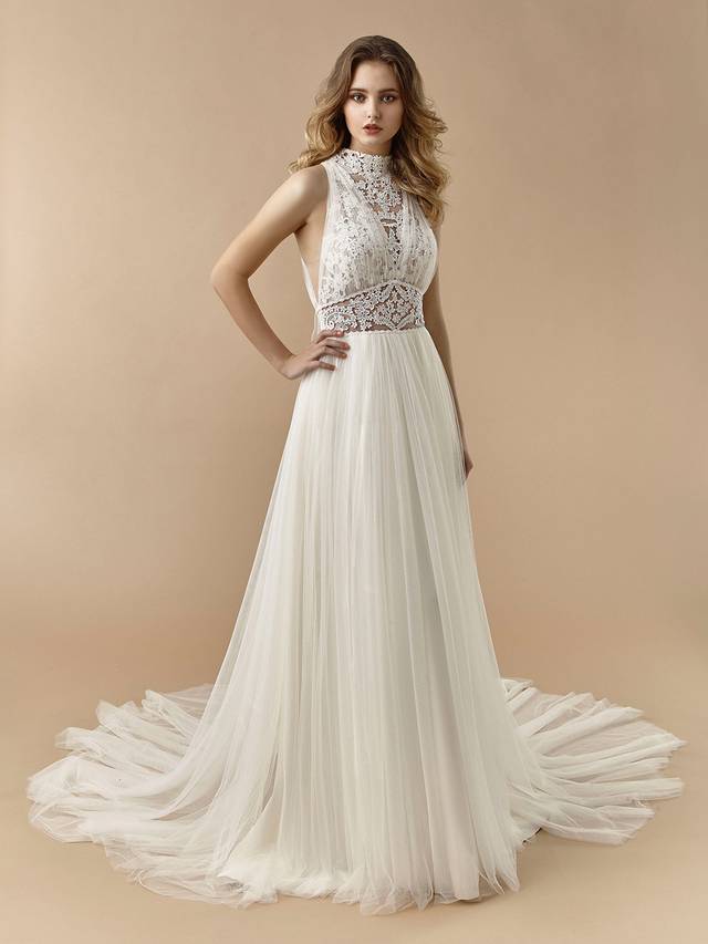 Code: Enzoani Beautiful BT20-04 Code: Enzoani Beautiful BT20-04 Old Hollywood glam gets a modern twist with this effortlessly elegant A-line gown. The high-neck illusion lace bodice provides all the sophistication and classic romance, complemented by a soft tulle skirt and modern, sexy illusion lace back with the sweetest bowtie.Colour Options: Ivory