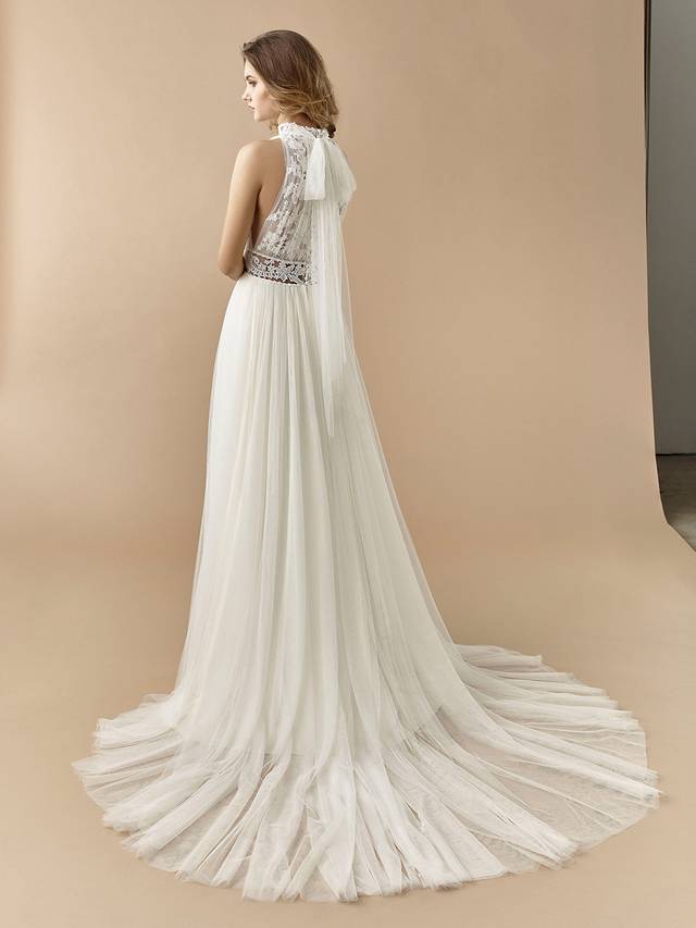 Code: Enzoani Beautiful BT20-04 Code: Enzoani Beautiful BT20-04 Old Hollywood glam gets a modern twist with this effortlessly elegant A-line gown. The high-neck illusion lace bodice provides all the sophistication and classic romance, complemented by a soft tulle skirt and modern, sexy illusion lace back with the sweetest bowtie.Colour Options: Ivory