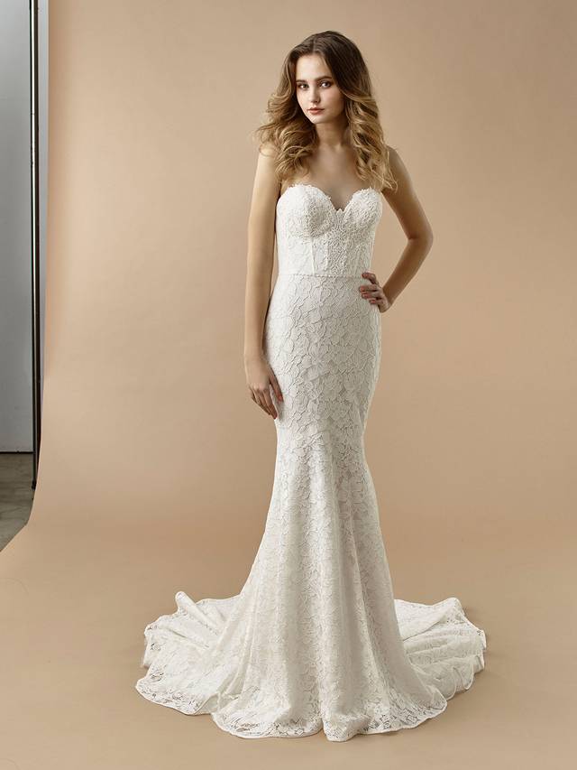 Code: Enzoani Beautiful BT20-16 Code: Enzoani Beautiful BT20-16 Gorgeous, eye-catching overlace is the centre of this alluring mermaid gown. A built-in corset gives extra support for the bride ready for a day of celebration. A sweetheart neckline and invisible back zipper closure complete the look.Colour Options: Ivory/Latte OR Ivory/Ivory