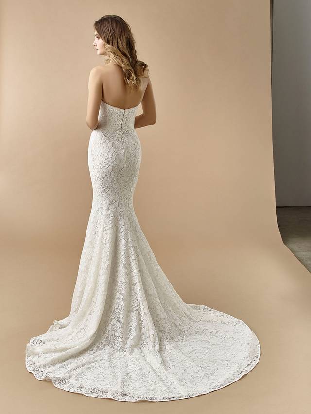Code: Enzoani Beautiful BT20-16 Code: Enzoani Beautiful BT20-16 Gorgeous, eye-catching overlace is the centre of this alluring mermaid gown. A built-in corset gives extra support for the bride ready for a day of celebration. A sweetheart neckline and invisible back zipper closure complete the look.Colour Options: Ivory/Latte OR Ivory/Ivory