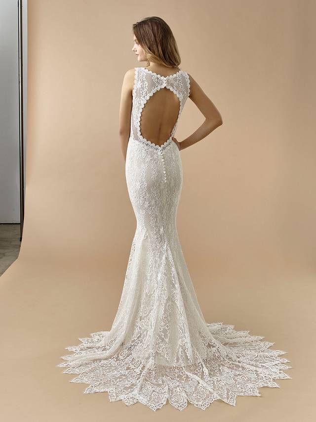 Code: Enzoani Beautiful BT20-22 Code: Enzoani Beautiful BT20-22 Playful, whimsical and chic, this mermaid gown features a high illusion neckline to highlight gorgeous vintage overlace. A modern twist is added with its edgy keyhole back, finished with covered buttons and an invisible zipper.Colour Options: Ivory/Latte OR Ivory/Beige OR Ivory/Ivory