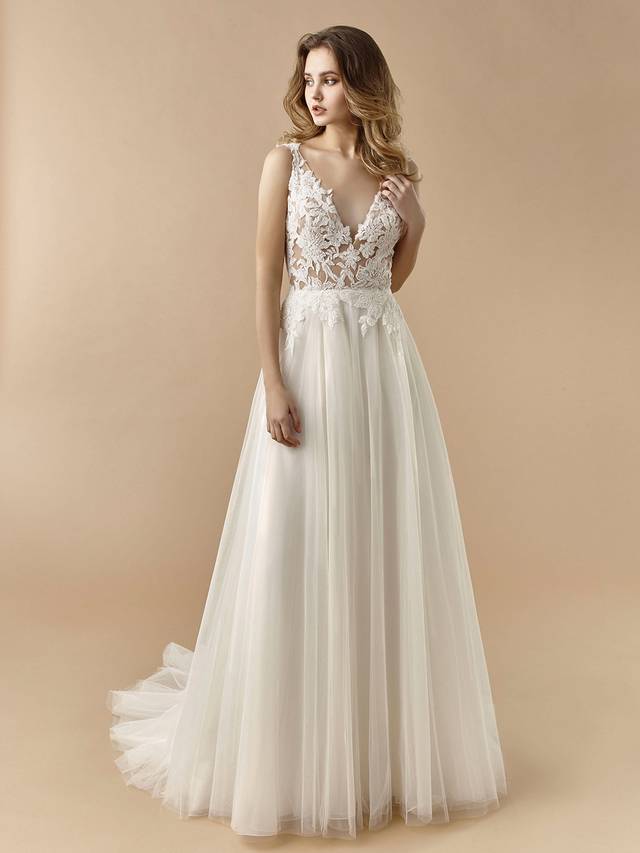 Code: Enzoani Beautiful BT20-26 Code: Enzoani Beautiful BT20-26 Sweet and feminine with all the right floral details. Large floral lace is showcased at the bodice as it leads to a jaw-dropping, beautiful low back. Soft layers of tulle at the skirt add to its whimsical enchantment. The lovely look is complete with lacy floral straps and covered buttons.Colour Options: Ivory/Beige OR Ivory/Ivory