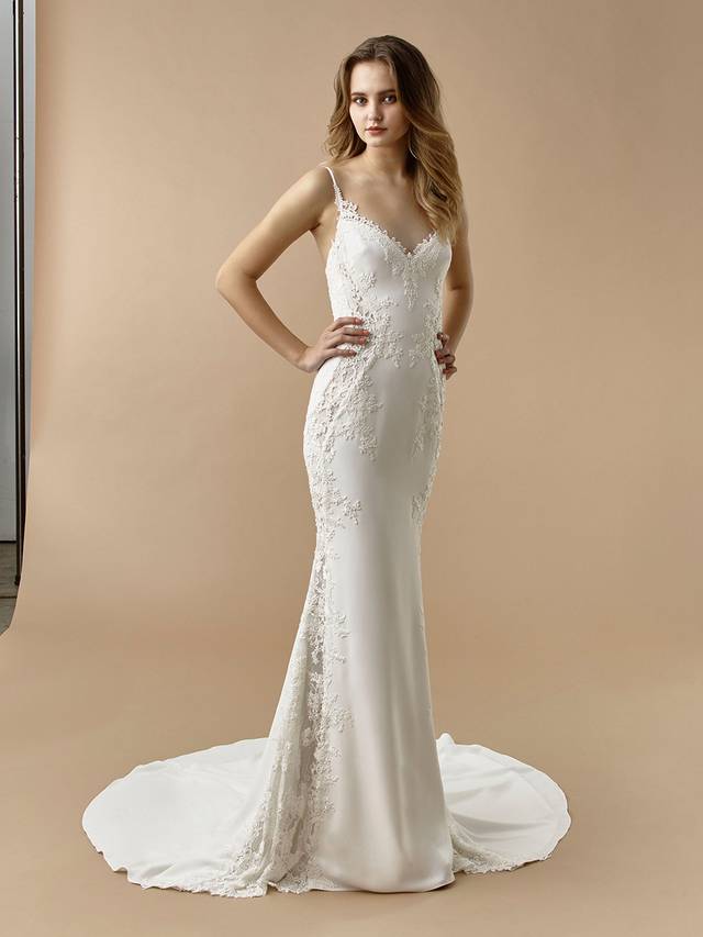 Code: Enzoani Beautiful BT20-27 Code: Enzoani Beautiful BT20-27 Chic, sweet, and alluring, this mermaid gown is sure to enchant. Delicate lace cascades over soft, supportive stretch georgette from the romantic sweetheart neckline to the flowing train. A lace illusion panel is added to the bottom for an unexpected, elegantly modern twist.Colour Options: Ivory