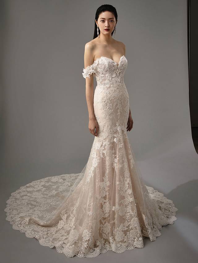 Code: Enzoani Blue - Marija Code: Enzoani Blue - Marija Ethereal and whimsical elements are all crafted into one gown. With its mermaid silhouette and gorgeous tulle train, Marija is sure to captivate all eyes. Chantlily lace is placed throughout the gown with detachable floral, off-shoulder sleeves. This look is finished with covered buttons for a completely romantic look.Colour Options: Ivory/Beig OR Ivory/Ivory