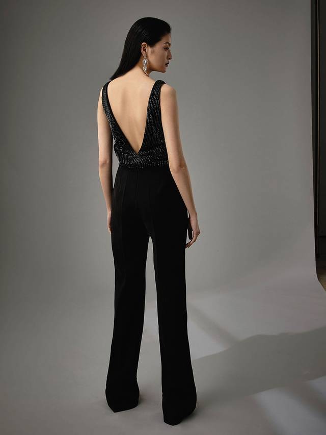Code: Enzoani Blue - Marisabel Code: Enzoani Blue - Marisabel Edgy and chic, this is meant for the modern bride. Complete with the most exquisite beadwork at the bodice, Marisabel is sure to dazzle your guests. A low, open back adds an element of cheekiness. Move with ease and mobility as this jumpsuit finishes with sleek, pocketed trousers and an invisible zipper.Colour Options: Ivory OR Black