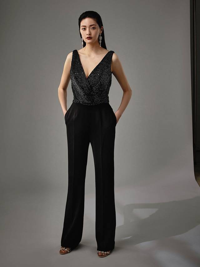 Code: Enzoani Blue - Marisabel Code: Enzoani Blue - Marisabel Edgy and chic, this is meant for the modern bride. Complete with the most exquisite beadwork at the bodice, Marisabel is sure to dazzle your guests. A low, open back adds an element of cheekiness. Move with ease and mobility as this jumpsuit finishes with sleek, pocketed trousers and an invisible zipper. Colour Options: Ivory OR Black