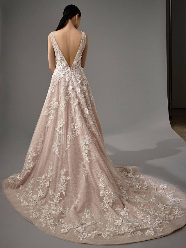 Code: Enzoani Blue - Marlowe Code: Enzoani Blue - Marlowe Romantic and dreamy with the perfect dose of glitz and glam. This full-length, A-line gown features sweet floral 3D motif lace on a sultry V-neckline bodice. Sequined tulle cascades down the length of the skirt, creating shimmer and shine for your walk down the aisle. Finished with a plunging low V-back and an invisible zipper closure.Colour Options: Ivory/Latte/Nude OR Ivory/Ivory/Ivory OR Ivory/Ivory/Nude