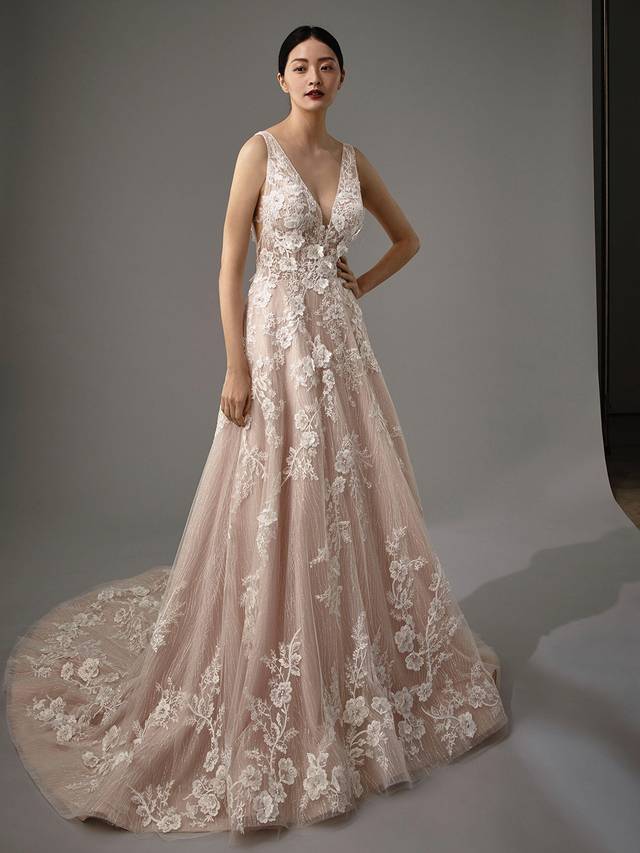 Code: Enzoani Blue - Marlowe Code: Enzoani Blue - Marlowe Romantic and dreamy with the perfect dose of glitz and glam. This full-length, A-line gown features sweet floral 3D motif lace on a sultry V-neckline bodice. Sequined tulle cascades down the length of the skirt, creating shimmer and shine for your walk down the aisle. Finished with a plunging low V-back and an invisible zipper closure.Colour Options: Ivory/Latte/Nude OR Ivory/Ivory/Ivory OR Ivory/Ivory/Nude