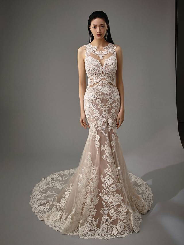 Code: Enzoani Blue - Matilda Code: Enzoani Blue - Matilda Mesmerize with this mermaid gown's jaw-dropping illusion back. Lace is carefully placed throughout the gown for added regality while crystal buttons trail down the back for a subtly elegant finishing touch. Complete with a dazzling tulle skirt.Colour Options: Ivory/Nude/Nude OR Ivory/Ivory/Ivory OR Ivory/Ivory/Nude OR Ivory/Sand/Nude