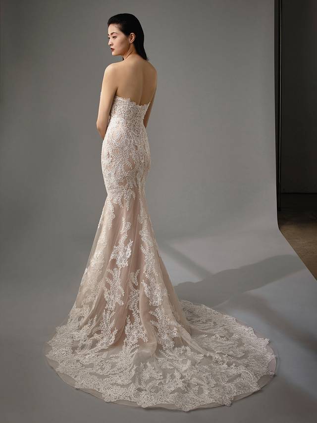 Code: Enzoani Blue - Monique Code: Enzoani Blue - Monique Dreamy and alluring, this mermaid gown is sure to have heads turning. All-over lace and a curve-hugging silhouette with a plunging sweetheart neckline are sure to be a winning combination. Delicate crystal buttons finish this timeless look. Colour Options: Ivory/Beige/Nude OR Ivory/Ivory/Ivory OR Ivory/Ivory/Nude