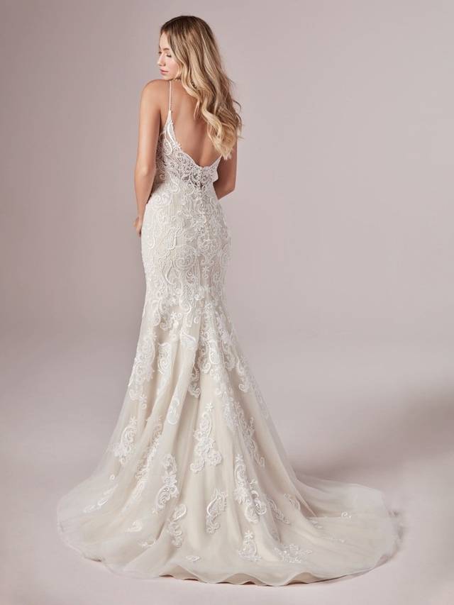 Code: Rebecca Ingram - Adelaide - IN STUDIO Code: Rebecca Ingram - Adelaide - IN STUDIO Go full beach mode in this romantic mermaid wedding dress. (Even the lace motifs look like seashells and sunset waves!)Lace motifs over tulle. Beaded lace motif bodice. llusion V-back. V-neckline. Beaded spaghetti straps. Lined with Orlando satinColour Options: All Ivory OR Ivory Over Soft Blush