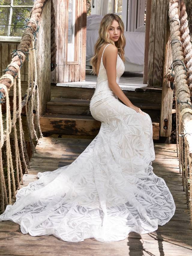 Code: Rebecca Ingram - Elsie - IN STUDIO Are those feathers? Palm leaves? Paintbrush strokes? Keep your bridal party guessing with this extraordinary mermaid wedding dress in shimmery sequined lace inspired by the elementsColour Options: Ivory over Nude  OR  Ivory  OR  Ivory over Soft Pearl