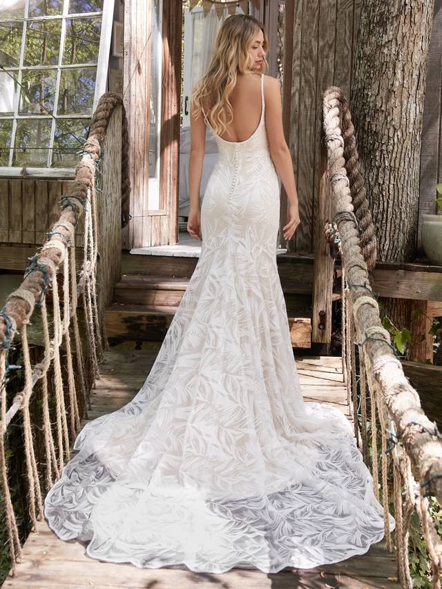 Code: Rebecca Ingram - Elsie - IN STUDIO Are those feathers? Palm leaves? Paintbrush strokes? Keep your bridal party guessing with this extraordinary mermaid wedding dress in shimmery sequined lace inspired by the elementsColour Options: Ivory over Nude  OR  Ivory  OR  Ivory over Soft Pearl