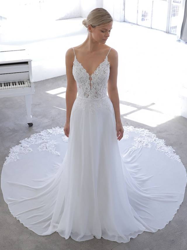Code: Enzoani Blue Novella - IN STUDIO Code: Enzoani Blue Novella - IN STUDIO This airy A-line feels like a love story. The one where you're in a field of flowers with the breeze running through, blowing at your light chiffon skirt. You feel light, but not without delicate details, such as the sequin floral embroidered and chantilly lace. The beaded straps and back neckline give a touch of glimmer. NOVELLA is the sweet, free-spirited