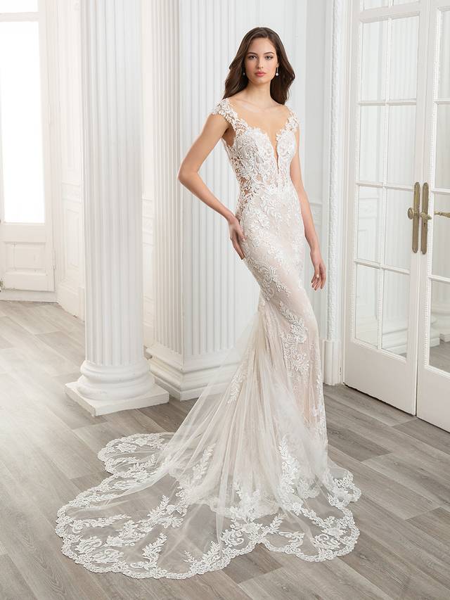 Code: Etoile Cameron - ARRIVING SOON Code: Etoile Cameron - ARRIVING SOON A designer favorite, the stunning CAMERON features a classic, off-shoulder neckline with sparkling hand-beading, as well as exquisite baroque and floral body-contouring lace placement throughout the gown. Finished with a gorgeously dramatic sculpted lace train. Colour Options: Ivory/Nude/Nude OR Ivory/Sand/Nude OR Ivory/Ivory/Nude
