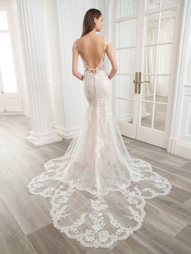 Code: Etoile Cameron - ARRIVING SOON Code: Etoile Cameron - ARRIVING SOON A designer favorite, the stunning CAMERON features a classic, off-shoulder neckline with sparkling hand-beading, as well as exquisite baroque and floral body-contouring lace placement throughout the gown. Finished with a gorgeously dramatic sculpted lace train. Colour Options: Ivory/Nude/Nude OR Ivory/Sand/Nude OR Ivory/Ivory/Nude