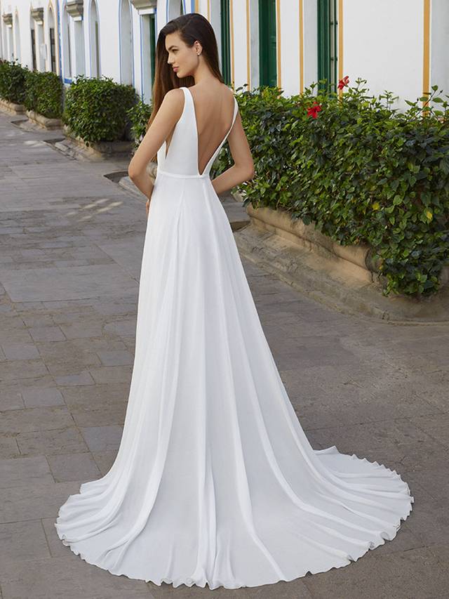 Code: Love By Enzoani Bree Code: Love By Enzoani Bree Float down the aisle in Bree, a soft, layered chiffon, A-line dream. A sweet, thin belt, plunging illusion neckline and illusion side cut-outs cinch the waistline and beautifully accentuate the curves for a modern spin on a classic, romantic silhouette. For an added touch of drama, Bree features a sexy front slit. We can’t get enough! Colour Options: Ivory