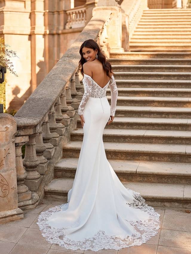 Code: Moonlight Collection J6871 Code: Moonlight Collection J6871 Classic modernity meets romance in Style J6871. This mermaid style wedding dress features luxurious crepe back satin fabric in a flattering form-fitting silhouette. The playful strapless scoop neckline works well at any venue while the detachable off-shoulder sleeve, featuring illusion net fabric covered in re-embroidered lace appliques, can be added for a more formal bridal look. The stunning open back features a deep-V design with intricate illusion lace details.Colour Option: Ivory